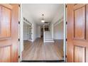 Elegant foyer with hardwood floors, staircase, and open view to other rooms at 1364 Manget Way, Dunwoody, GA 30338