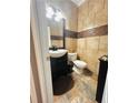 Well-appointed bathroom with a modern vanity, decorative tile, and a comfortable layout at 47 Trailside Cir, Hiram, GA 30141