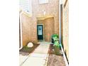 Inviting doorway featuring brickwork, stylish decor, and a welcoming entrance to the home at 47 Trailside Cir, Hiram, GA 30141