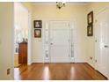 Inviting entryway with hardwood floors and bright white trim and front door at 549 Trailwood Sw Ln, Marietta, GA 30064