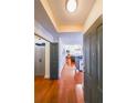 Inviting entryway featuring hardwood floors, gray doors, and a glimpse into the living spaces, offering a warm welcome at 230 E Ponce De Leon Ave # 327, Decatur, GA 30030