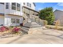 Multi-level entrance with front porch and concrete driveway at 695 Old Peachtree Rd, Lawrenceville, GA 30043