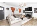 Inviting living room featuring a fireplace, neutral tones, and lots of natural light at 710 Josh Ln, Lawrenceville, GA 30045