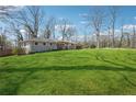 A single-story home sits on a beautifully maintained, expansive green lawn at 2518 Crestdale Se Cir, Atlanta, GA 30316