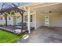 Exterior view featuring a charming pergola, carport, and inviting front porch at 2518 Crestdale Se Cir, Atlanta, GA 30316