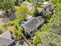 Backyard aerial view showcasing a patio, mature trees, and landscaping at 745 Princeton Mill Run, Marietta, GA 30068