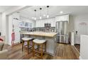 Modern kitchen with stainless steel appliances, a central island, and stylish pendant lighting at 1090 Indale Sw Pl, Atlanta, GA 30310