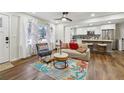 Open living space features hardwood floors and a view to the kitchen, complete with modern decor at 1090 Indale Sw Pl, Atlanta, GA 30310