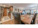 Cozy dining area with a rustic wood table and seating for four next to an open concept kitchen at 3201 Lenox Ne Rd # 16, Atlanta, GA 30324
