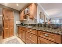 Well-appointed kitchen features granite counters and stainless steel appliances and tile floors at 3201 Lenox Ne Rd # 16, Atlanta, GA 30324