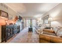 Bright living room with fireplace, French doors to a balcony, and comfortable seating at 3201 Lenox Ne Rd # 16, Atlanta, GA 30324