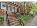 Brick townhomes featuring brick steps, wrought iron railings, and black shutters at 1261 Lavista Ne Rd # M-4, Atlanta, GA 30324