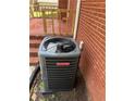 Close-up of a Goodman HVAC system against a brick exterior wall at 3153 Lake Monroe Rd, Douglasville, GA 30135