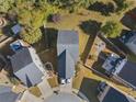 Aerial view of a home in a neighborhood with manicured lawns and mature trees at 4050 Ironwood Dr, Atlanta, GA 30349