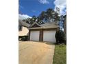 Two car garage with individual doors and new driveway at 108 Creekwood Trl, Acworth, GA 30102
