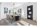 Bright dining room with hardwood floors, modern lighting fixture, and ample natural light at 1247 Bridges Sw Ave # A, Atlanta, GA 30310