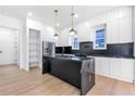 Sleek kitchen featuring a black marble island, subway backsplash and stainless steel appliances at 1247 Bridges Sw Ave # A, Atlanta, GA 30310