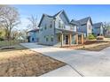 New construction, modern farmhouse exterior with a spacious driveway and well-maintained front yard at 1247 Bridges Sw Ave # B, Atlanta, GA 30310