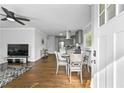 Inviting living room with hardwood floors seamlessly flowing into the adjacent modern kitchen at 2587 Lancaster Dr, Atlanta, GA 30344