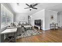 Bright living room featuring hardwood floors, ceiling fan and neutral decor at 2587 Lancaster Dr, Atlanta, GA 30344