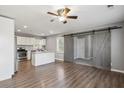 Eat-in kitchen featuring stainless steel appliances, granite counters, and gray barn doors at , Atlanta, GA 30315