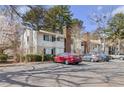 Attractive condo with charming exterior, chimney, well-maintained landscaping, and convenient parking at 1508 Wingate Way, Atlanta, GA 30350