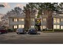 Attractive condo with charming exterior, second story staircase, landscaping, and convenient parking at 1508 Wingate Way, Atlanta, GA 30350