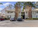 Attractive condo with charming exterior, second story staircase, landscaping, and convenient parking at 1508 Wingate Way, Atlanta, GA 30350
