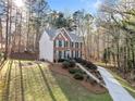 Charming two-story brick home with a long driveway and beautiful yard at 2285 Briarwood Trl, Cumming, GA 30041