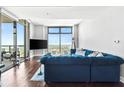 Living room with floor to ceiling windows and a comfortable seating arrangement for relaxing and watching television at 270 17Th Nw St # 4208, Atlanta, GA 30363