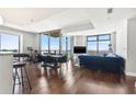 Living room featuring hardwood floors, floor to ceiling windows and access to a balcony with an amazing view at 270 17Th Nw St # 4208, Atlanta, GA 30363