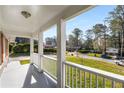 Inviting view from the covered front porch of the charming property and surrounding neighborhood at 2600 Cohassett Ct, Decatur, GA 30034