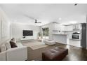 Open-concept living space with modern finishes, natural light, and backyard access at 147 Hermer Nw Cir, Atlanta, GA 30311