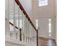 Bright, two story foyer with wood-look floors leads to a sunny living area at 667 Oaktree Park Ct, Lawrenceville, GA 30044