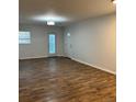 Spacious living room with modern wood-look flooring and plenty of natural light at 1076 Grant Se Way, Atlanta, GA 30315