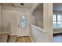 Inviting entryway with tile floors and a decorative glass front door at 1809 Fairpointe Trce, Stone Mountain, GA 30088