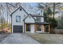Beautiful two-story home with a front porch, garage, and well-maintained landscaping at 6382 Revena Dr, Morrow, GA 30260
