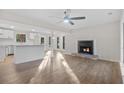 Bright living room with hardwood floors, fireplace, and open floor plan at 6382 Revena Dr, Morrow, GA 30260