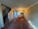 Spacious living room featuring staircase access and ample natural light at 7042 Oakhill Cir, Austell, GA 30168