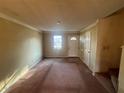 Inviting living room with a large window, providing plenty of natural light and space at 7042 Oakhill Cir, Austell, GA 30168