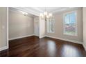 Bright dining room with hardwood floors, natural light and classic trim work throughout at 830 Nottingham Se Dr, Smyrna, GA 30082