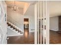 Spacious foyer with staircase, chandelier and wood floors at 195 Hermer Nw Cir, Atlanta, GA 30311