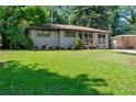Attractive one-story home featuring a well-maintained lawn, tidy landscaping, and gray brick facade at 3021 San Juan Dr, Decatur, GA 30032