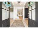Inviting foyer with hardwood floors and stylish lighting fixtures at 4105 Brookview Dr, Cumming, GA 30040
