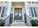 Elegant entryway with double doors and classic brick steps at 4105 Brookview Dr, Cumming, GA 30040