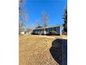 Charming single-story home with a welcoming front porch, walkway, and well-maintained landscaping at 383 Third Ave, Scottdale, GA 30079