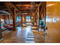 Spacious living room with exposed brick, wooden beams, and an open floor plan at 490 Marietta Nw St # 101, Atlanta, GA 30313