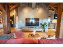 Cozy living room featuring exposed wooden beams, modern furniture, and an entertainment center at 490 Marietta Nw St # 101, Atlanta, GA 30313