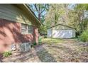 Spacious backyard with a detached garage, providing ample storage space at 1189 E East Fayetteville Rd, Riverdale, GA 30296