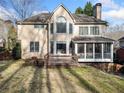 Spacious backyard with a wooden deck and screened-in porch; perfect for outdoor entertaining at 5071 Vinings Estates Se Ct, Mableton, GA 30126